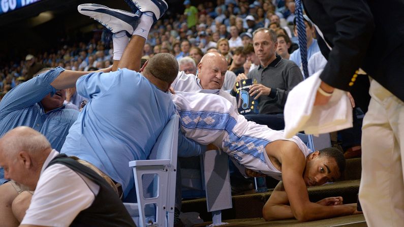 Brice Johnson of the North Carolina Tar Heels dives out-of-bounds to save a loose ball during a game against the Tulane Green Wave on Wednesday, December 16, in Chapel Hill, North Carolina. <br />