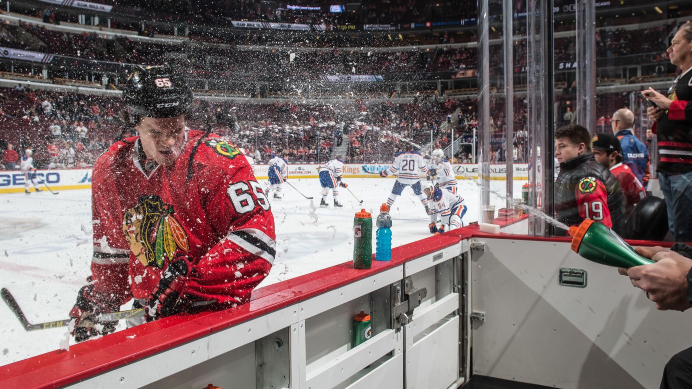 Andrew Shaw of the Chicago Blackhawks is sprayed with water before an NHL game against the Edmonton Oilers at the United Center in Chicago on Thursday, December 17.<br />