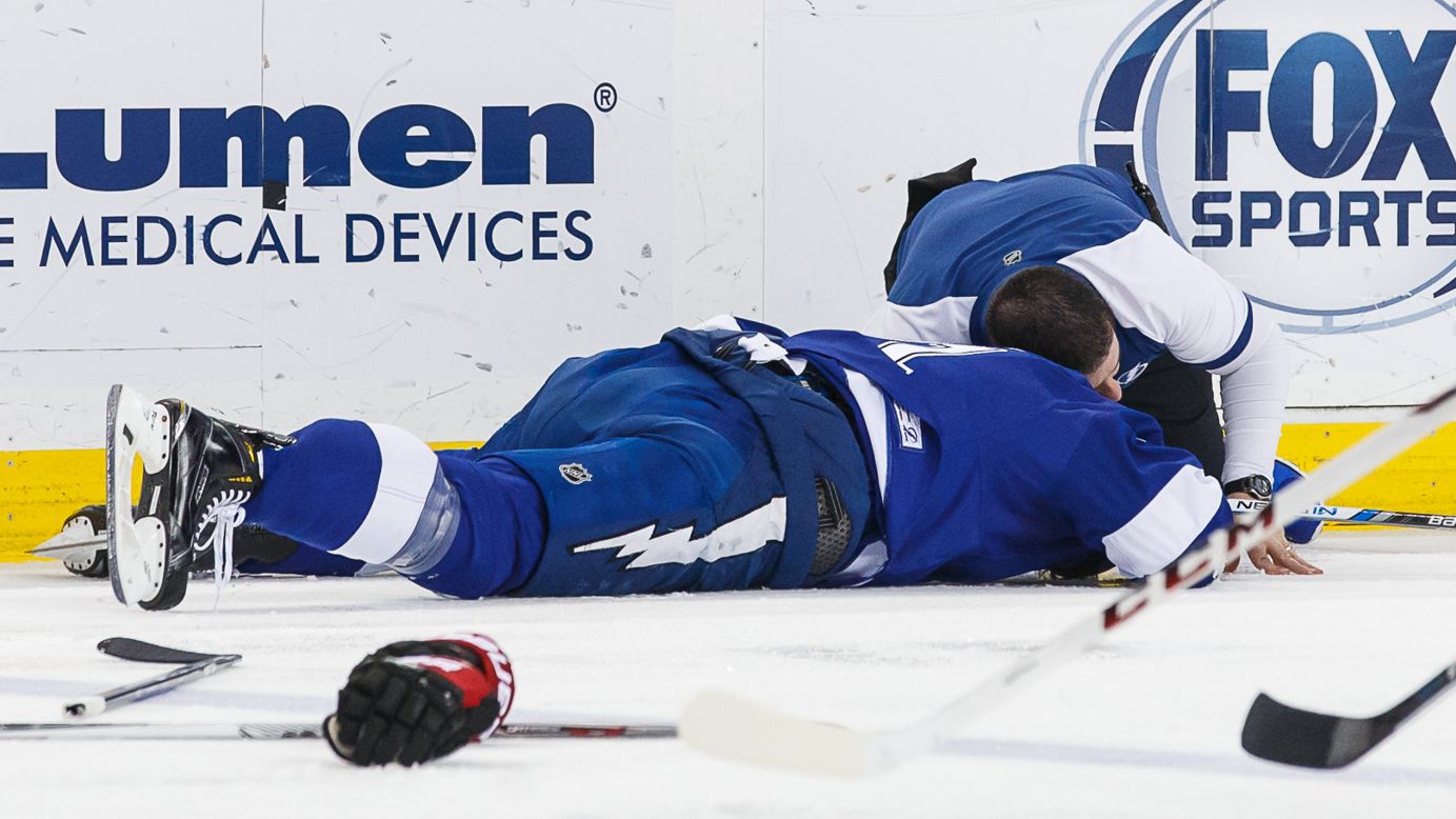 Head Athletic Trainer Tom Mulligan tends to Brian Boyle of the Tampa Bay Lightning after a hit to the head during the first period against the Ottawa Senators at the Amalie Arena in Tampa, Florida, on Sunday, December 20. 
