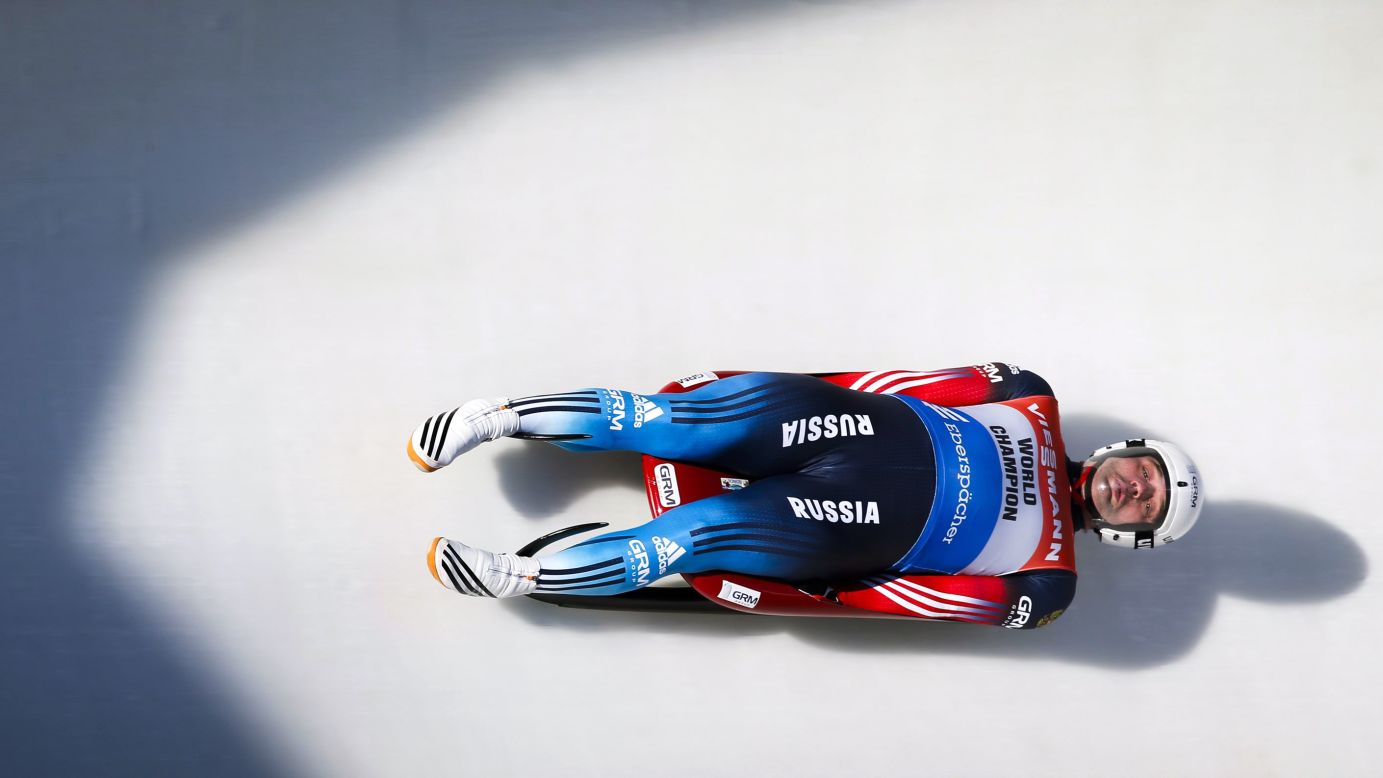 Russia luger Semen Pavlichenko races down the track during the men's World Cup luge competition in Calgary, Alberta, on Saturday, December 19.