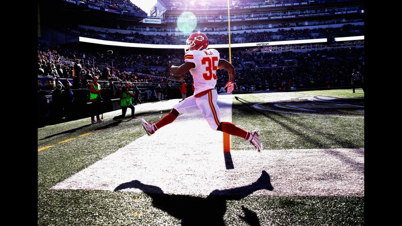 Running back Charcandrick West of the Kansas City Chiefs celebrates after rushing for a first quarter touchdown against the Baltimore Ravens at M&T Bank Stadium in Baltimore on Saturday, December 20. <a href="index.php?page=&url=http%3A%2F%2Fedition.cnn.com%2F2015%2F12%2F15%2Fsport%2Fgallery%2Fwhat-a-shot-sports-1215%2Findex.html">See 39 amazing sports photos from last week</a>