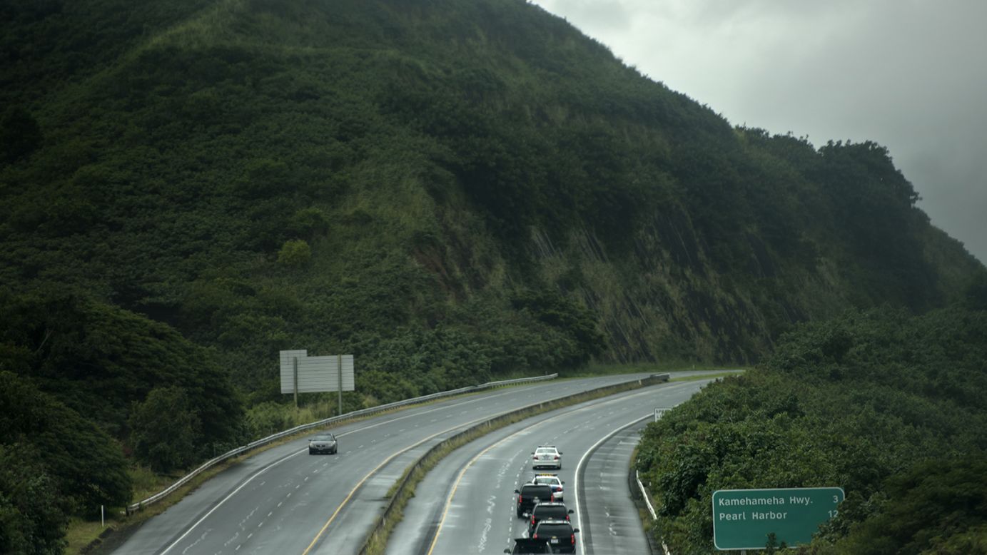 A motorcade takes the Obama family to a hike on Sunday, December 20, in Honolulu.