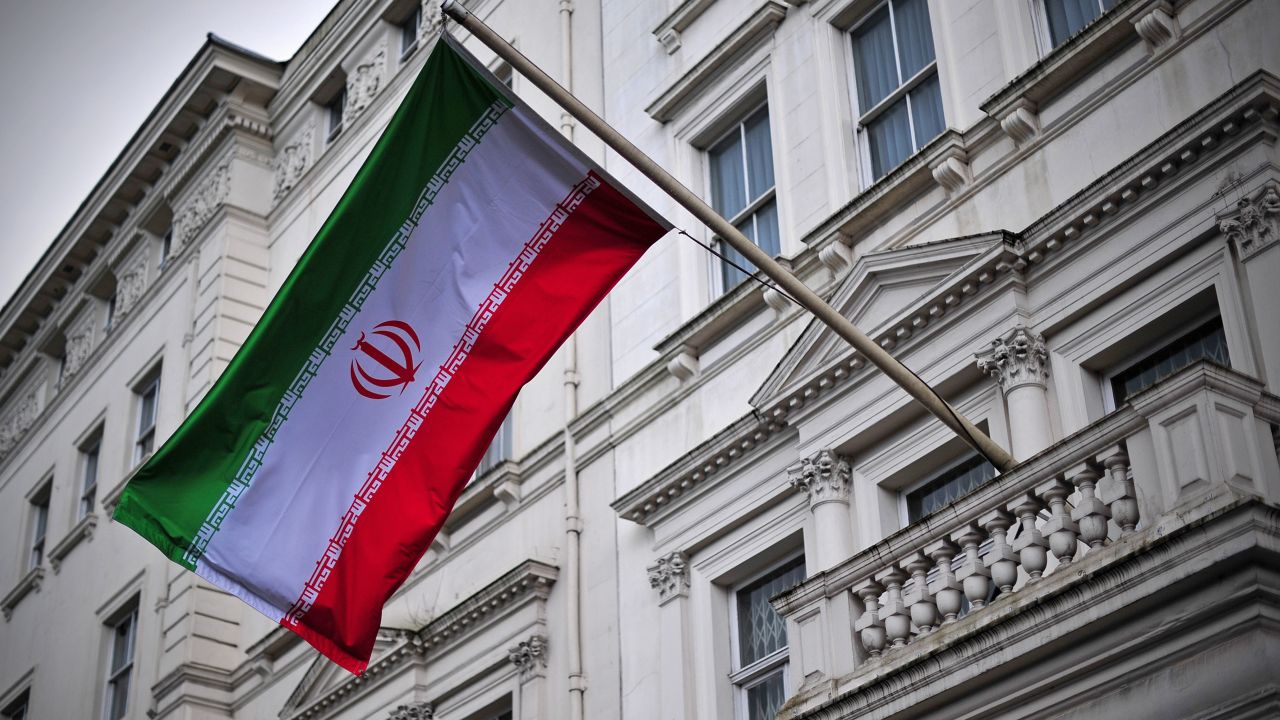 The Iranian flag hangs outside the Iranian embassy in central London on February 20, 2014. Iran and Britain officially resumed Thursday diplomatic relations severed by London after students stormed its Tehran embassy in 2011, a senior Iranian official said.