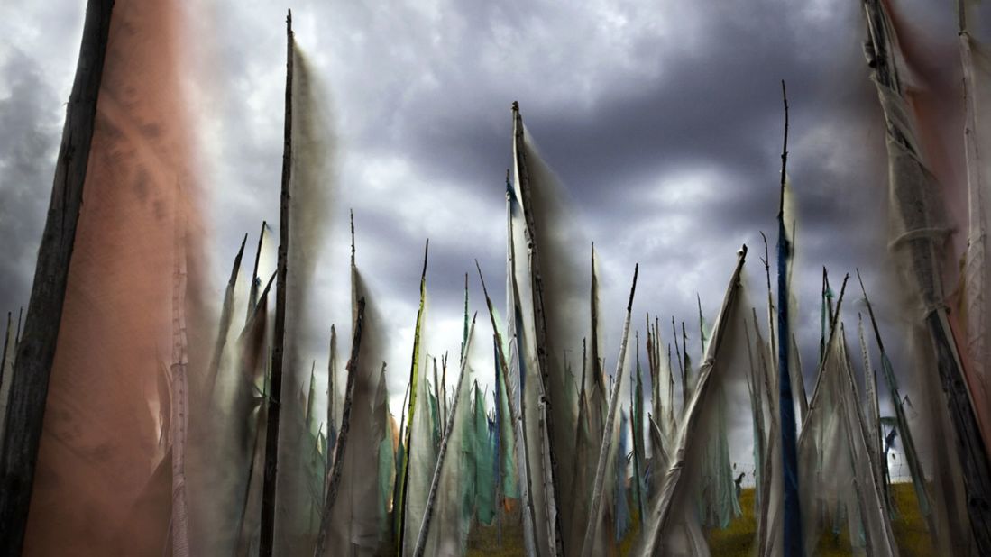 Canadian Larry Louie traveled to the Tibetan Tagong grasslands of Sichuan province to capture prayer flags fluttering under leaden skies. His image was selected as winner in the "colors of the world" category. (Photo: Larry Louie/www.tpoty.com)