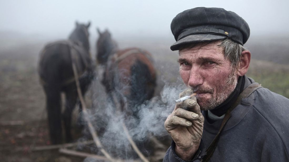 A timeless image that could've been taken anywhere across rural Europe, anytime over the past century, earns Australian Kanashkevich Mitchell the top prize in the "faces, people, encounters" category. His photo shows a Hungarian-Romanian man taking a break from plowing a field in Maramures, Romania. (Photo: Kanashkevich Mitchell/www.tpoty.com)