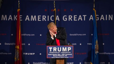 Trump pretends to sleep December 7 as he references fellow candidate Jeb Bush at a Pearl Harbor Day Rally in Mount Pleasant, South Carolina. It was here that Trump read a press release calling for a "complete and total shutdown of Muslims entering the United States" in light of the San Bernardino terror attacks.