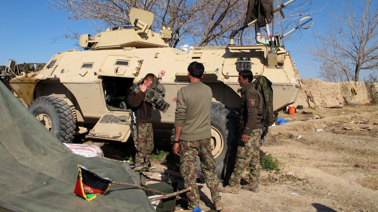 Afghan National Army (ANA) soldiers prepare for combat during an ongoing battle with Taliban militants in the Nad Ali district of Helmand on December 22, 2015. Military planes have dropped food and ammunition to besieged Afghan forces battling to push Taliban insurgents out of Sangin, officials said December 22, two days after the emboldened militants stormed the opium-growing district. Islamists have captured large swathes of the district in the southern province of Helmand which British and US forces struggled for years to defend.Fleeing local residents reported bloody gunfights as the Taliban advanced on the district centre, highlighting a worsening security situation across Afghanistan a year after NATO formally ended its combat operations. AFP PHOTO / Noor Mohammad / AFP / NOOR MOHAMMAD (Photo credit should read NOOR MOHAMMAD/AFP/Getty Images)