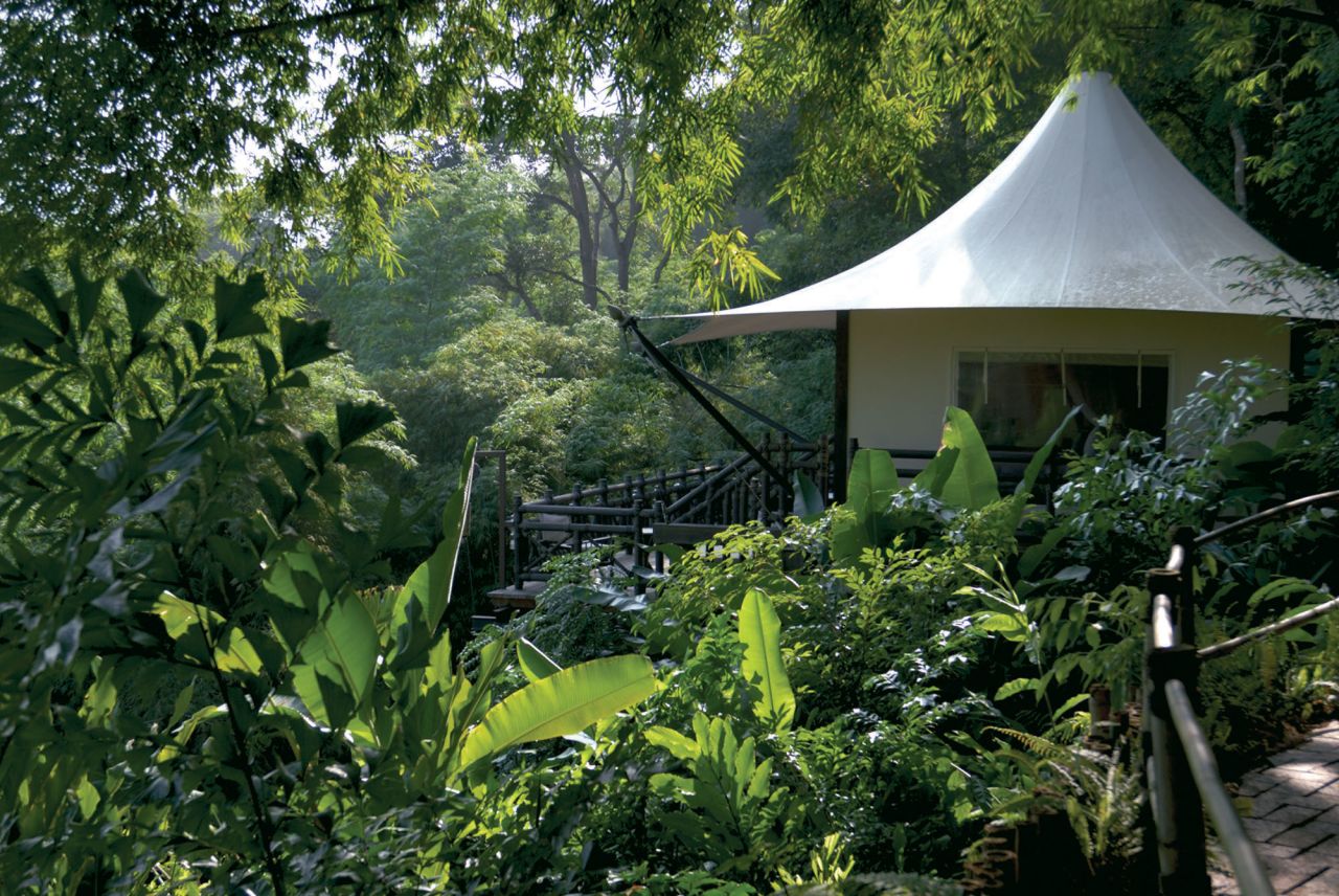 <strong>Four Seasons Tented Camp, Thailand</strong>: This luxury "camp" is built on a cliffside overlooking the Ruak River in northern Thailand, surrounded by the jungles and mountains and elephants roaming freely. 