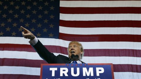 Donald Trump speaks to guest gathered during a campaign event at the International Air Response facility on December 16, 2015 in Mesa, Arizona. Trump is in Arizona the day after the Republican Presidential Debate hosted by CNN in Las Vegas, Nevada.