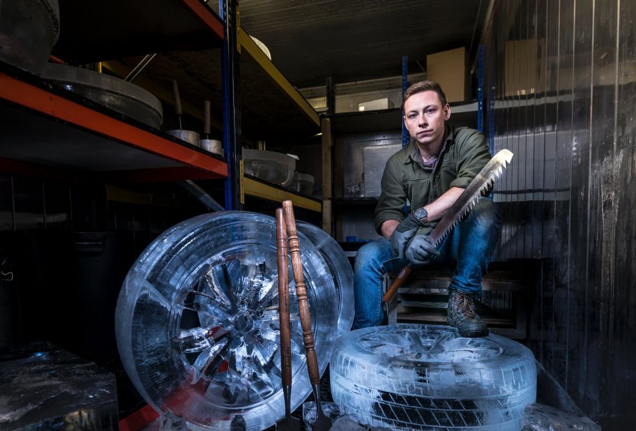 Jack Hackney of Hamilton Ice Sculptors, which collaborated with Lexus for this project, poses with the wheels he and his colleagues handcrafted out of frozen water. 
