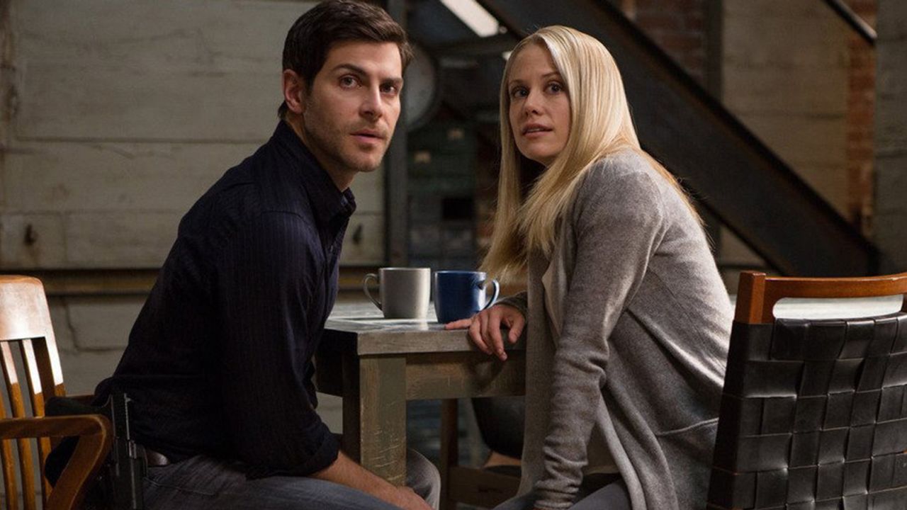 David Giuntoli (left) as Nick Burkhardt and Claire Coffee (right) as Adalind Schade are shown in a scene from "Grimm."
