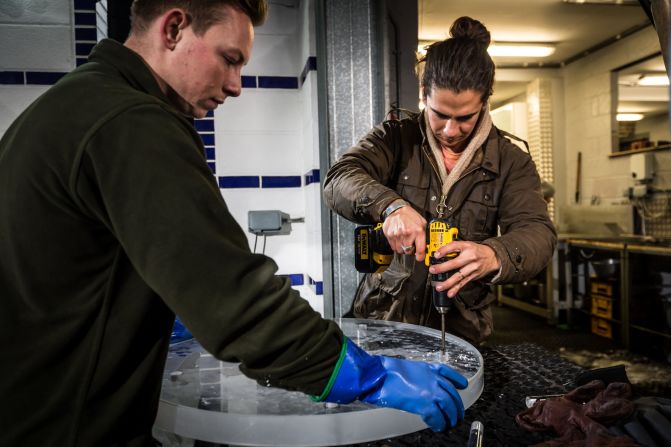 Craftsmen from Hamilton Ice Sculptors work meticulously to replicate the Lexus NX's wheels and tires -- down to the tread patterns.