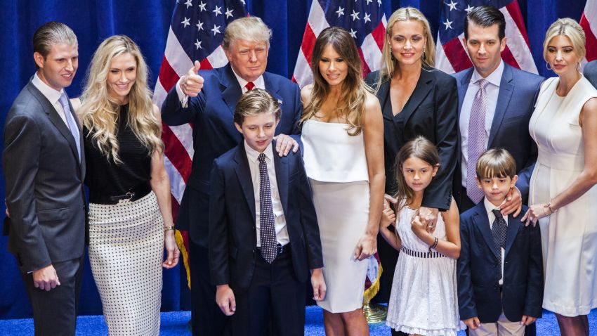 (Left to right) Eric Trump, Lara Yunaska Trump, Donald Trump, Barron Trump, Melania Trump, Vanessa Haydon Trump, Kai Madison Trump, Donald Trump Jr., Donald John Trump III, and Ivanka Trump pose for photos on stage after Trump announced his candidacy for the U.S. presidency at Trump Tower on June 16, 2015 in New York City.