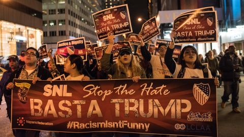 Members of Latino organizations march from the Trump Tower to NBC studios in New York to protest Trump's "Saturday Night Live" appearance on November 7.