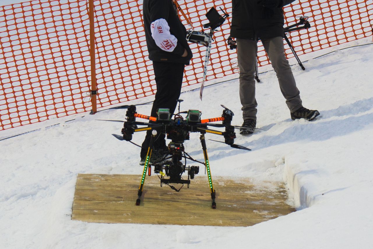 The drone fitted with a camera -- shown here prior to its crash -- landed just inches behind him at the top of the slope.<br />