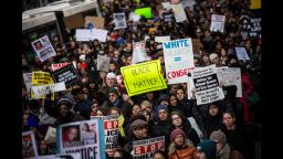 People march in the National March Against Police Violence, which was organized by National Action Network, through the streets of Manhattan on December 13, 2014.