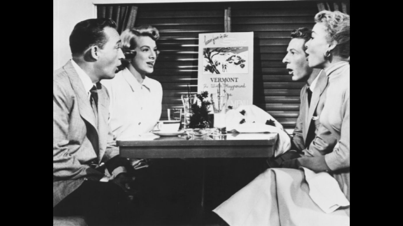 Crosby, Clooney, Kaye and Vera-Ellen sing about snow in a scene on a train.