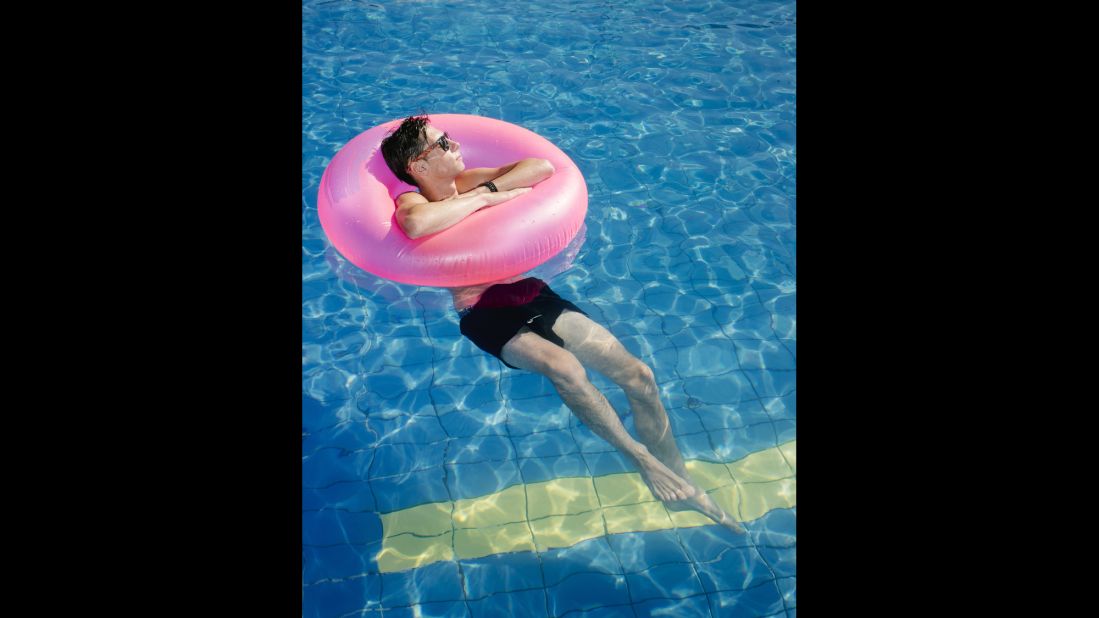 A tourist swims in a pool at the Kos Palace hotel.