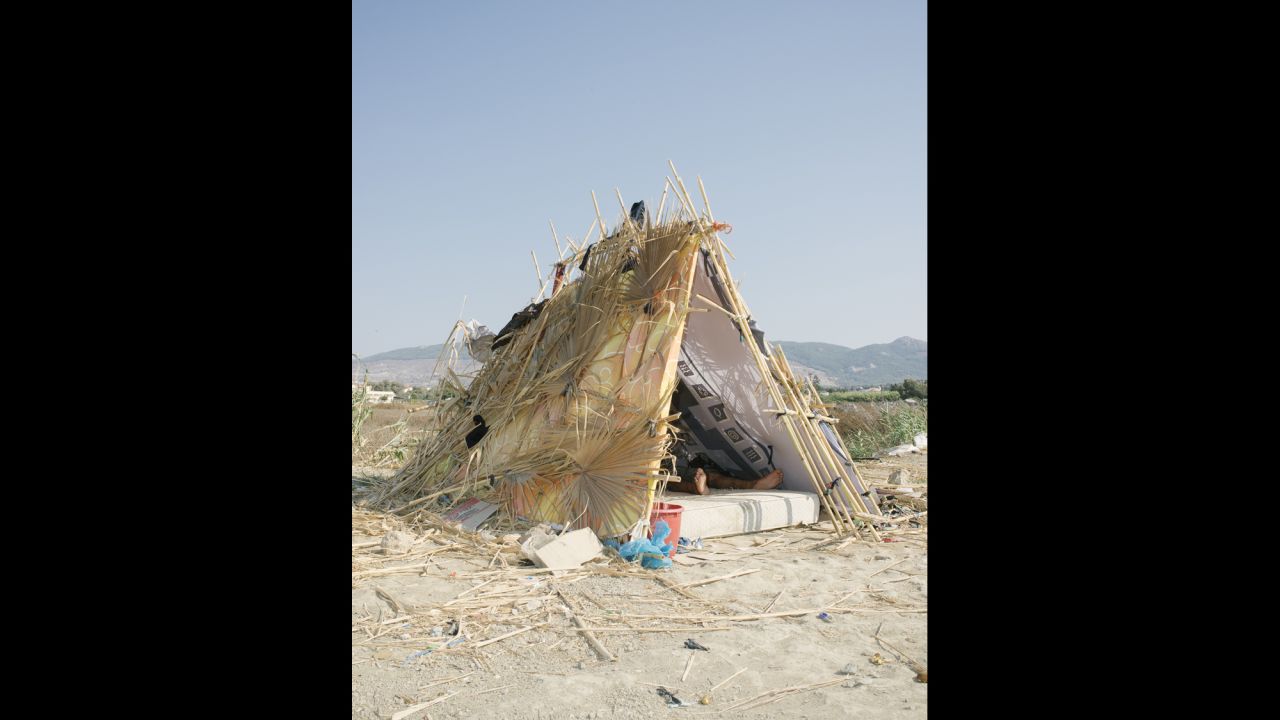 This migrant tent was made of palm leaves and trash.