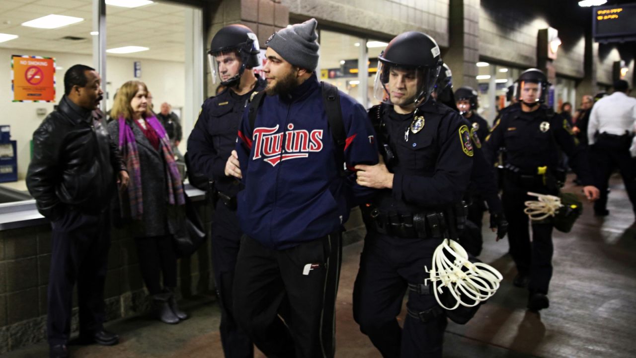 Law enforcement officers detain a protester at the Mall of America in Bloomington, Minnesota, on Wednesday.