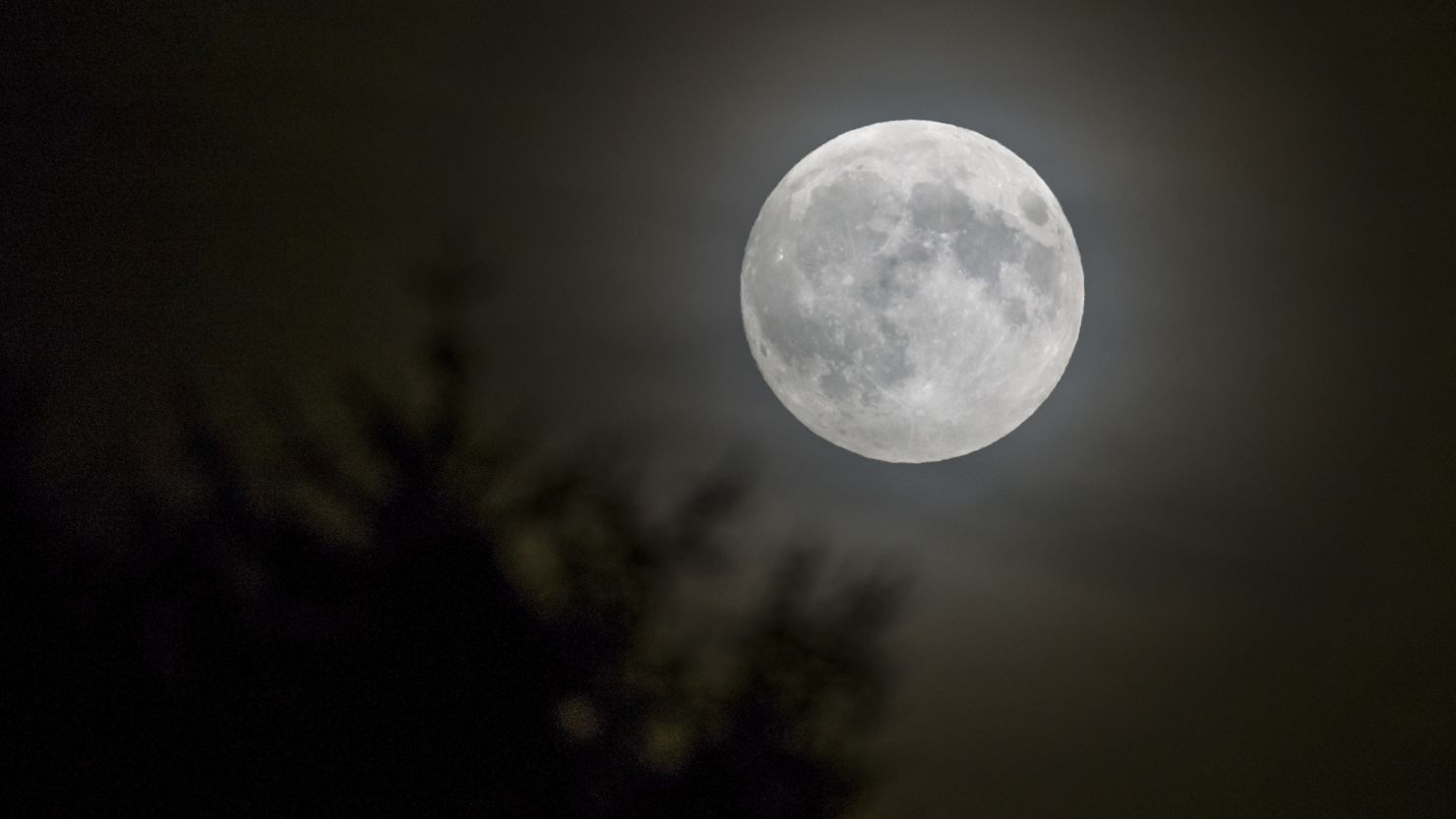 A full moon is seen in Lausanne, Switzerland, in September. Look for one on Christmas morning.