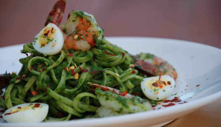 Laksa, a popular Peranakan noodle dish with coconut milk-favored spicy broth, is reinvented as a pesto sauce with pasta at chef Willin Low's popular Wild Rocket restaurant.