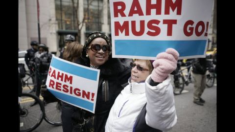 Protesters use the design of the Chicago flag for their placards demanding the mayor's resignation.