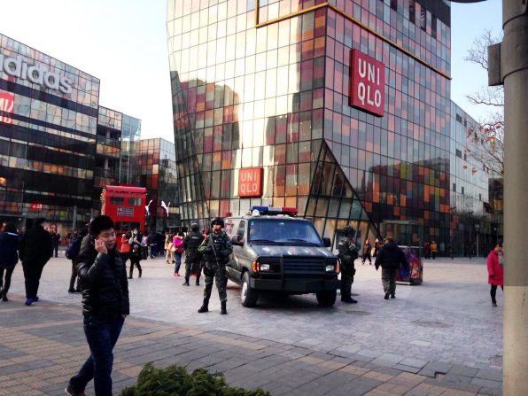 Armed police officers patrol the Sanlitun area of Beijing on December 24, 2015. The British and U.S. embassies in China say they have received information of possible threats against Westerners at and around Christmas in the popular district home to a high-end, open-plan mall and some of Beijing's best dining in Western cuisines.
