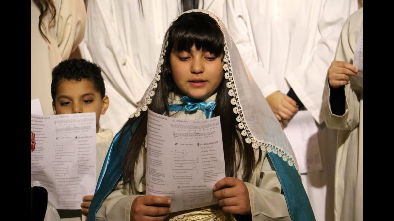 Children sing in a chorus at a Christmas church service at Antakya Orthodox Church in Hatay, Turkey, on Thursday.