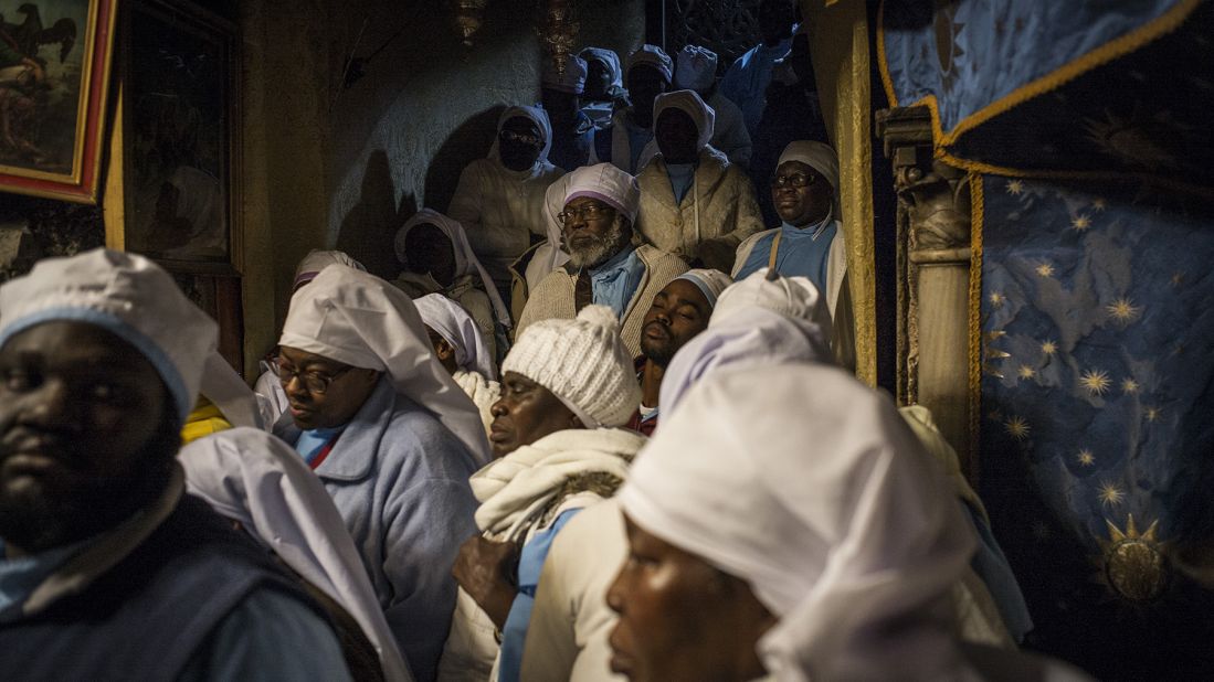 Nigerian pilgrims gather at the Church of the Nativity in Bethlehem, West Bank, on Thursday. Every year, thousands of Christian pilgrims travel to the church, which marks the site of the cave in which Jesus is said to have been born.