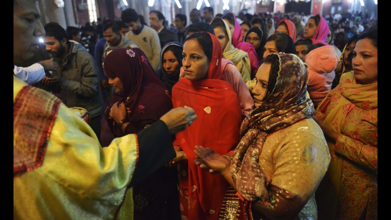 Pakistani Christians attend Christmas Day prayers at the Sacred Heart Cathedral Church in Lahore, Pakistan, on December 25.