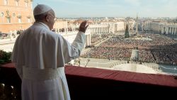Pope Francis delivers his blessing from the central balcony of St. Peter's Basilica at the Vatican on Christmas Day.