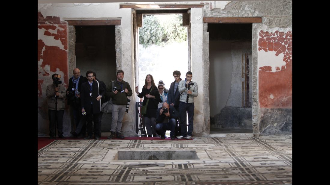 Journalists take photos in the Casa di Paquius Proculus.