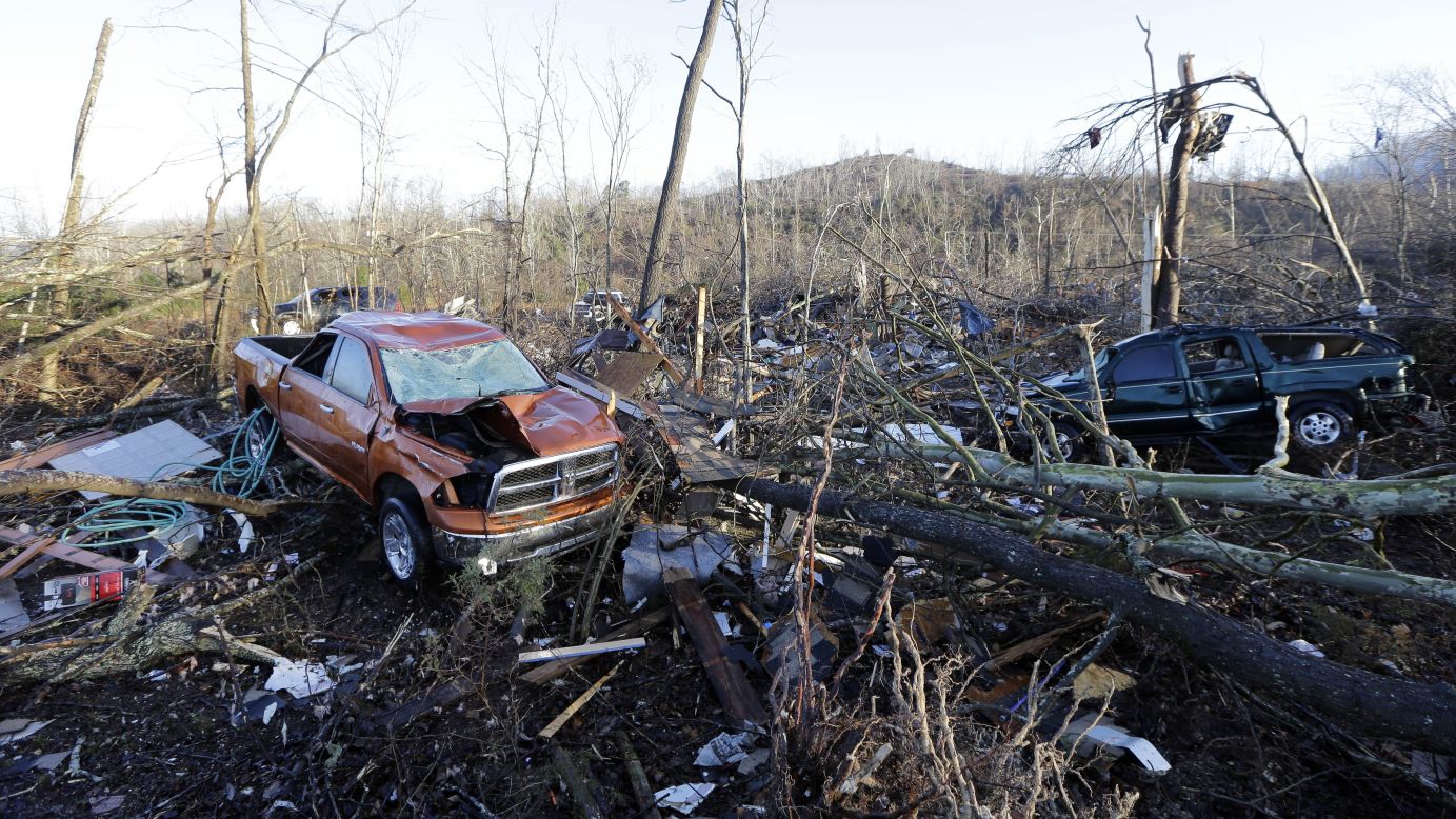 Vehicles and debris are scattered near Linden, Tennessee, on Thursday after a tornado charged through, leaving a trail of destruction.