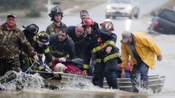 Emergency officials in Moulton, Alabama transport James Simmons by boat on December 25, because flooding prevented them from reaching him. Unseasonably warm weather helped spawn severe storms Friday after violent storms in the Southeast left dozens of families homeless by Christmas Eve.