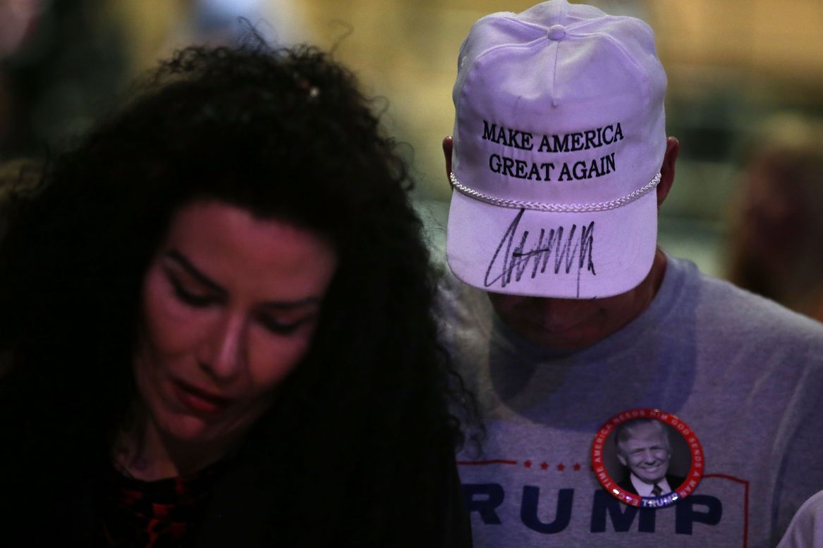 A supporter of Donald Trump wears a hat with Trump's autograph on it during a campaign rally in Las Vegas on December 14.