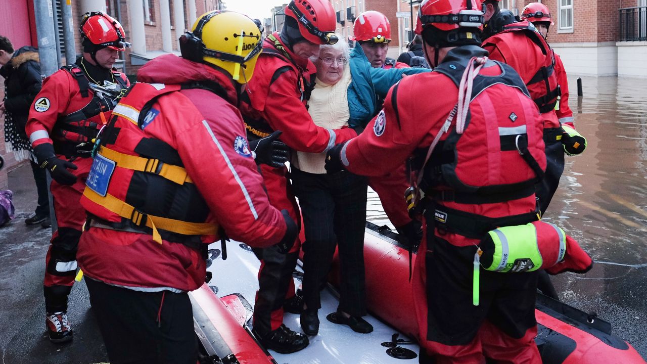 Members of Cleveland Mountain Rescue and soldiers from 2 Battalion The Duke of Lancasters Regiment assist members of the public as they are evacuated from the Queens Hotel in York city centre as the River Ouse floods on December 27, 2015 in York, England. Heavy rain over the Christmas period has caused severe flooding in parts of northern England, with homes and businesses in Yorkshire and Lancashire evacuated as water levels continue to rise in many parts.