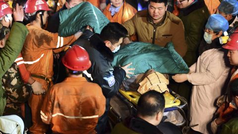 A trapped miner is rescued from a collapsed gypsum mine in Pingyi County, in east China's Shandong Province, on Friday, December 25.
