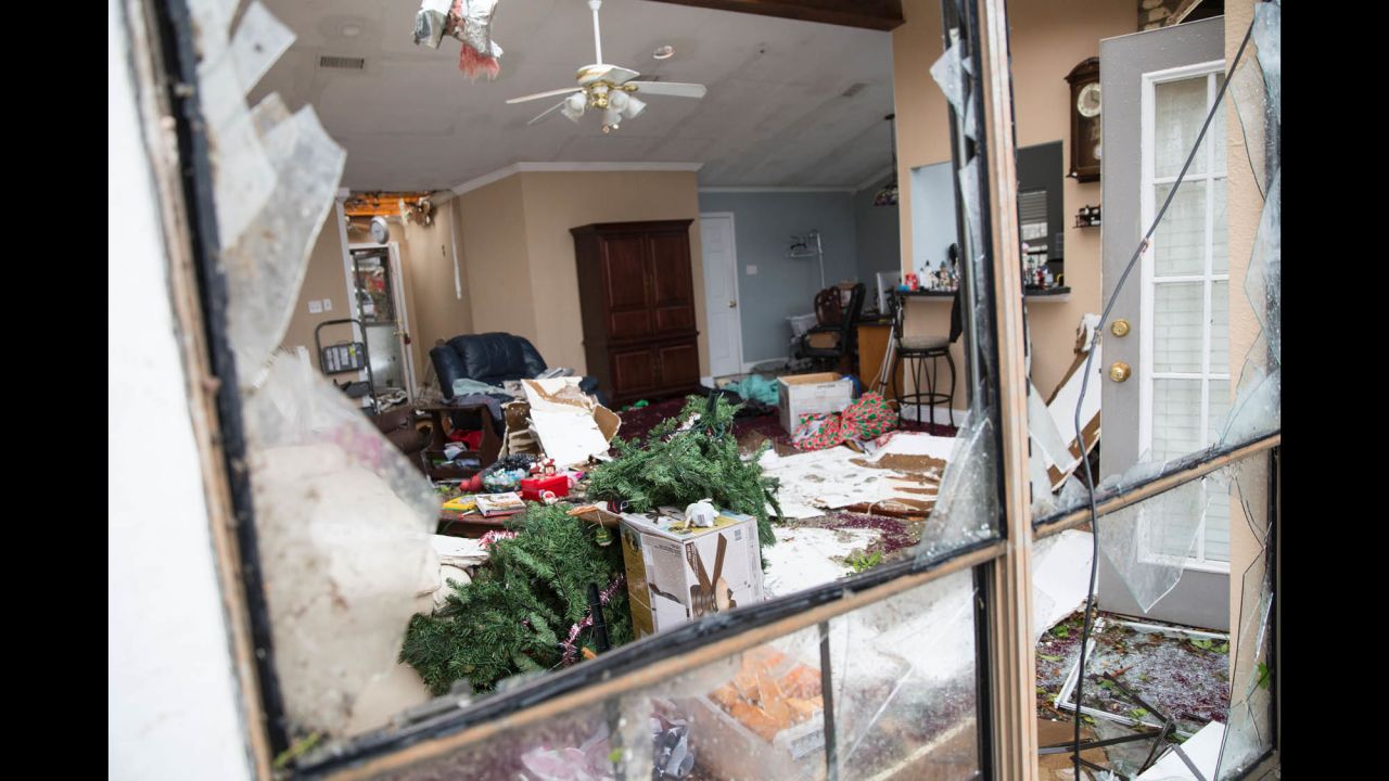 A Christmas tree lies in the wreckage of a family's home in Rowlett on December 27.
