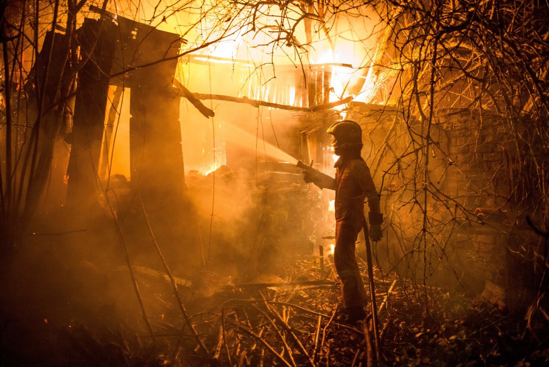 A firefighter battles against a blaze outbreak in northwest Spain.