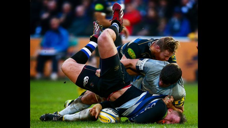 Bath rugby player Max Lahiff is tackled by Worcester's Donncha O'Callaghan during a Premiership match in Bath, England, on Sunday, December 27.