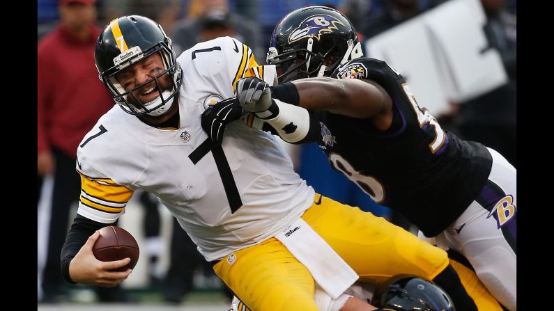 Elvis Dumervil, right, sacks Pittsburgh quarterback Ben Roethlisberger during an NFL game in Baltimore on Sunday, December 27. Baltimore upset its division rival 20-17, damaging its playoff hopes.