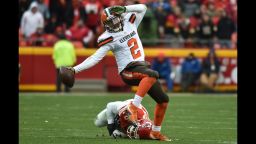 KANSAS CITY, MO - DECEMBER 27: Johnny Manziel #2 of the Cleveland Browns fights his way out of a tackle attempt from Derrick Johnson #56 of the Kansas City Chiefs at Arrowhead Stadium during the fourth quarter of the game on December 27, 2015 in Kansas City, Missouri. (Photo by Peter Aiken/Getty Images)