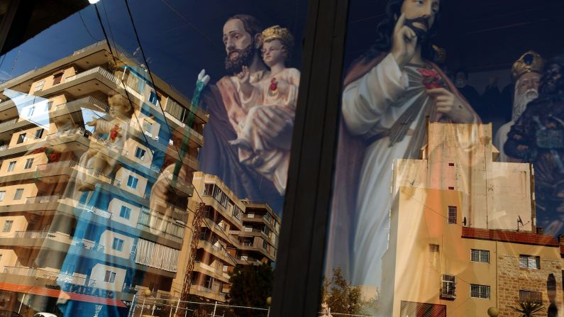 Christmas is a big deal in Lebanon, where well over a third of the population is estimated to be Christian. Both secular and religious festive decorations can be found across the country, like these figures reflected in a shop window.