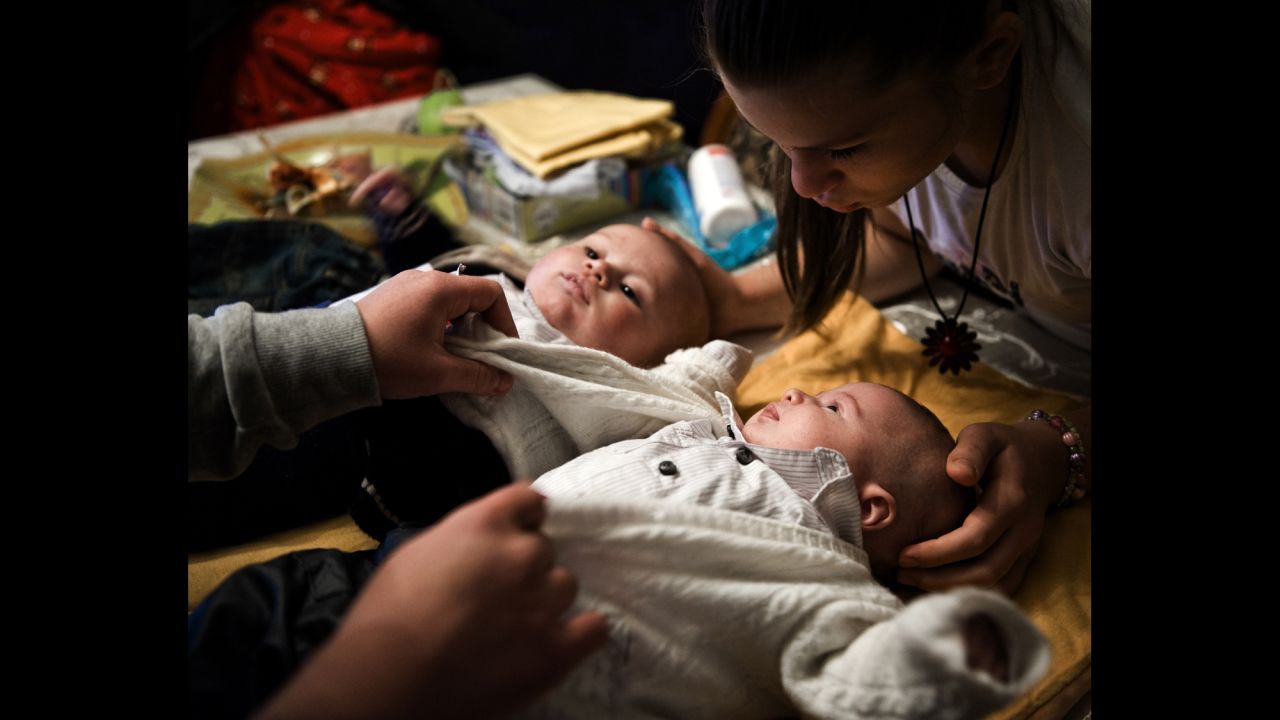 Angela, 18, and her sister Virna, right, 14, look after their babies, Francesco, left, and Vincenzo. The two sisters both became pregnant around the same time period.