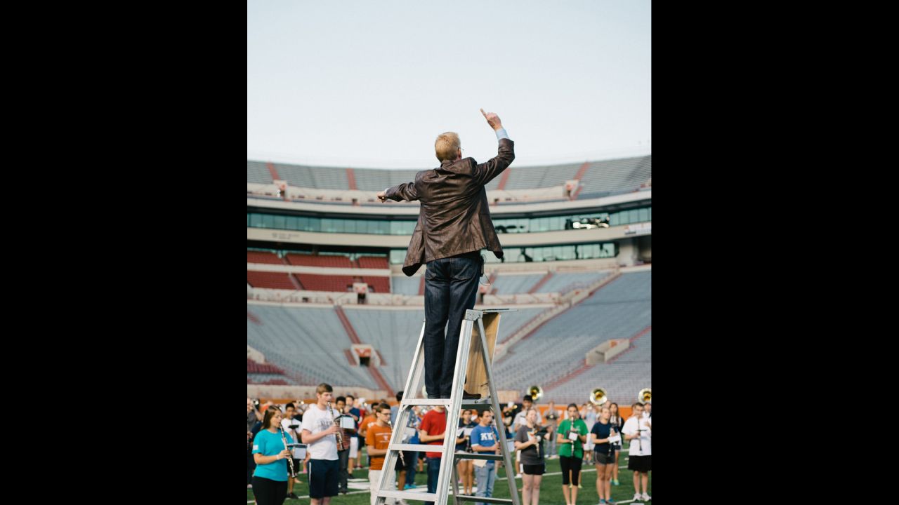 Robert Carnochan, director of The University of Texas Longhorn Band, conducts during rehearsal.