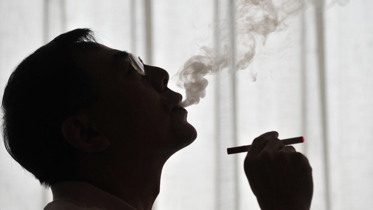 The inventor of the electronic cigarette, Hon Lik, smoking his invention in Beiijng on May 25, 2009. 