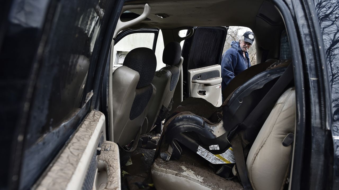 A man in Carthage airs out his truck, which he said had been submerged by floodwaters, on December 29.