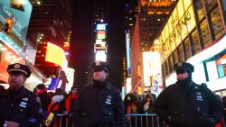 New York Police Department patrol in Times Square on December 31, 2014 in New York City. With an estimated one million people packing into Times Square and elsewhere around the city, New York has stepped up security measures.
