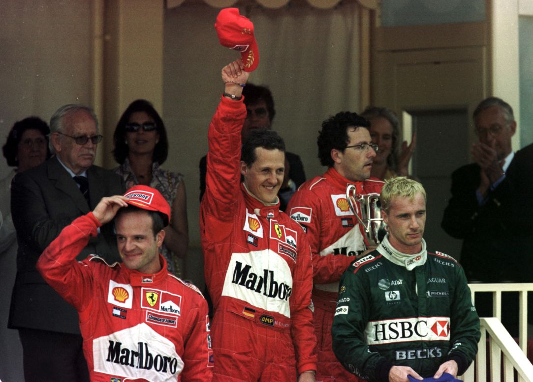 Jaguar raced to third place twice in its F1 history. Here a bleached blond Irvine climbs onto the podium at the 2001 Monaco Grand Prix alongside Rubens Barrichello (left) and  Michael Schumacher  (center).